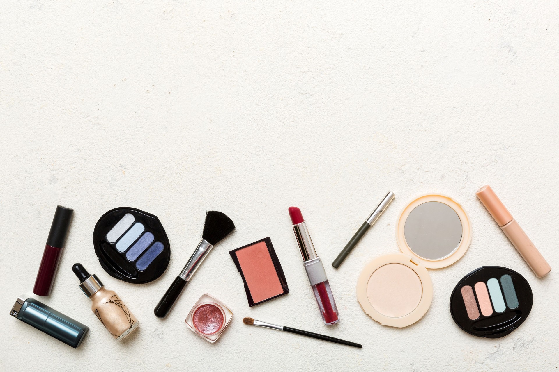 Professional makeup tools. Top view. Flat lay. Beauty, decorative cosmetics. Makeup brushes set and color eyeshadow palette on table background. Minimalistic style
